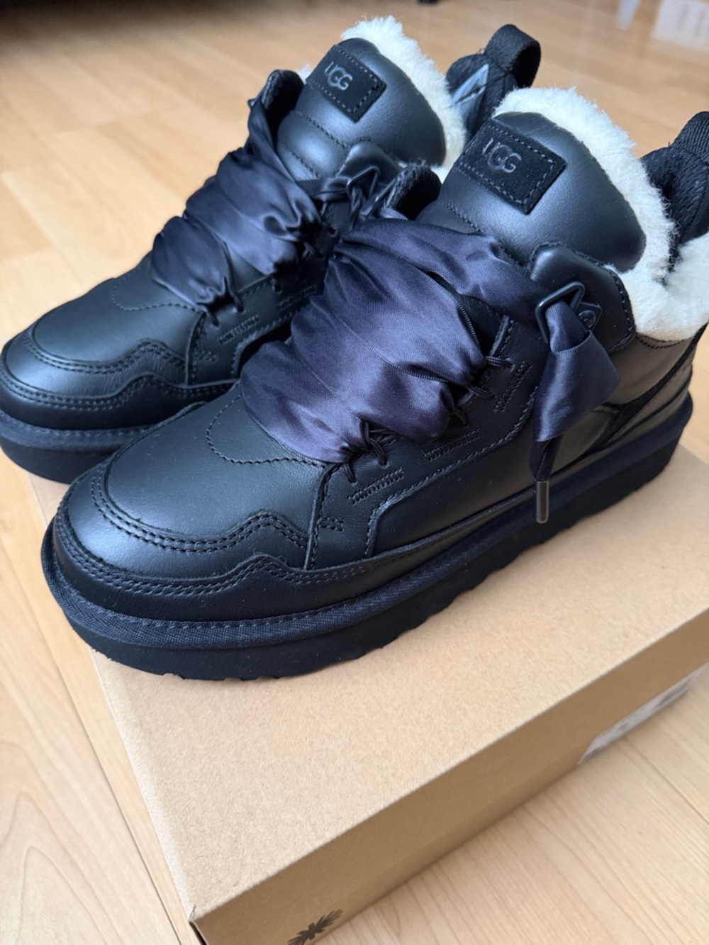 UGG Black Leather Platform Sneakers with Satin Ribbon Laces